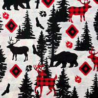 Cherry Pit Crafts microwaveable heating pad fabric with animal patterns: bears, deer, trees, paw prints, and red diamond shapes.