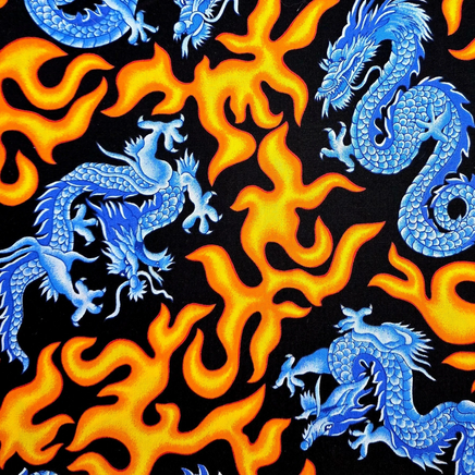 Cherry Pit Crafts blue dragons and orange flames on black cotton fabric. Animal pattern heating pad.