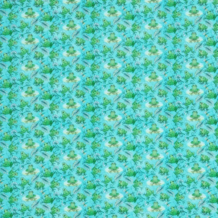 Cherry Pit Crafts blue cotton heating pad with a repeating pattern of green frogs and foliage.