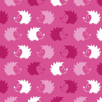 Cherry Pit Crafts microwaveable heating pad with cute hedgehog pattern in pink and white.