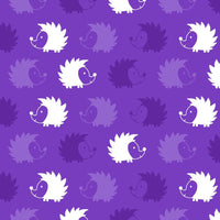 Cherry Pit Crafts microwaveable heating pad with an animal pattern of white, light purple, and dark purple hedgehogs on a purple background.
