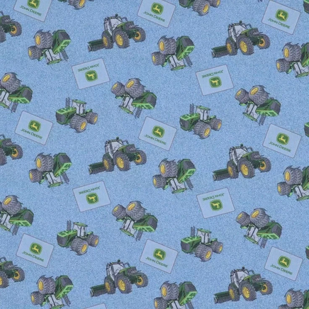 Cherry Pit Crafts blue cotton heating pad fabric with green John Deere tractors and logos.