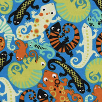 Cherry Pit Crafts microwaveable heating pad with a fun animal pattern featuring colorful lizards on a blue background. 100% cotton.