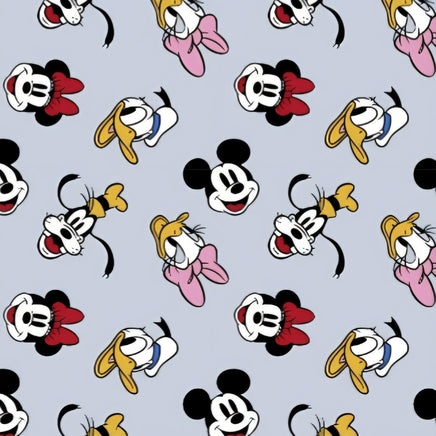Cherry Pit Crafts microwaveable heating pad fabric with Mickey, Minnie, Donald, and Daisy Duck patterns on a light blue background.