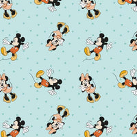 Cherry Pit Crafts light blue cotton fabric with repeating Mickey and Minnie Mouse pattern
