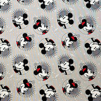 Cherry Pit Crafts grey cotton fabric with repeating pattern of Mickey and Minnie Mouse characters in circles.