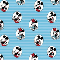 Cherry Pit Crafts blue cotton heating pad with repeating Mickey and Minnie Mouse pattern. Features Mickey in red shorts and Minnie in a blue polka dot dress.