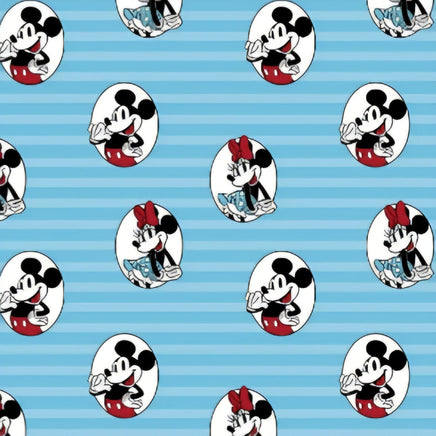 Cherry Pit Crafts blue cotton heating pad with repeating Mickey and Minnie Mouse pattern. Features Mickey in red shorts and Minnie in a blue polka dot dress.
