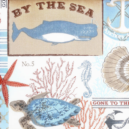 Cherry Pit Crafts microwaveable heating pad with a nautical "By The Sea" print featuring whales, anchors, sea turtles, starfish, and seahorses.