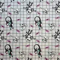 Cherry Pit Crafts Nightmare Before Christmas heating pad fabric with Jack, Sally, Zero, and spiders on a grid pattern.