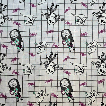 Cherry Pit Crafts Nightmare Before Christmas heating pad fabric with Jack, Sally, Zero, and spiders on a grid pattern.