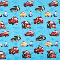 Cherry Pit Crafts blue 100% cotton fabric with Pixar Cars characters Lightning McQueen, Mater, Sheriff, and Luigi