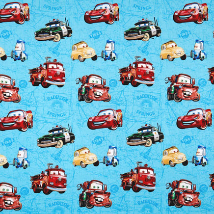 Cherry Pit Crafts blue 100% cotton fabric with Pixar Cars characters Lightning McQueen, Mater, Sheriff, and Luigi