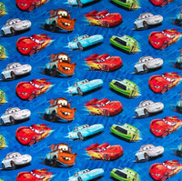 Cherry Pit Crafts Pixar Cars pattern heating pad with Lightning McQueen, Mater, and Sally Carrera on blue background.