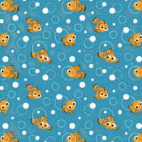 Cherry Pit Crafts microwaveable heating pad with a cute Pixar fish pattern on a blue background with white bubbles.