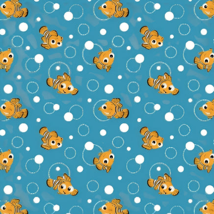 Cherry Pit Crafts microwaveable heating pad with a cute Pixar fish pattern on a blue background with white bubbles.