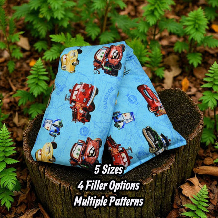 Cherry Pit Crafts light blue heating pad with Pixar characters, 100% cotton, available in 5 sizes and 4 filler options.