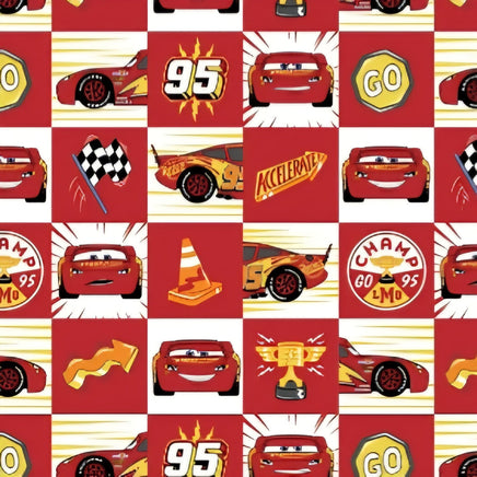 Cherry Pit Crafts Pixar themed heating pad with Lightning McQueen, checkered flags, traffic cones, and race car graphics on a red background.