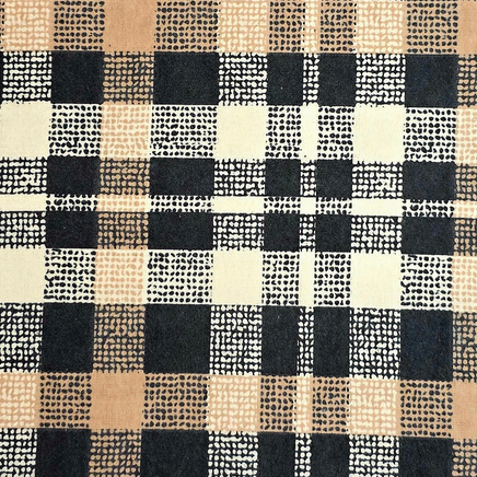 Cherry Pit Crafts plaid flannel heating pad in black, tan, and cream with a textured dot pattern.