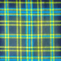 Cherry Pit Crafts plaid flannel heating pad in navy with lime green and bright blue plaid pattern.