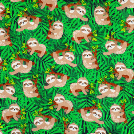 Cherry Pit Crafts microwaveable heating pad fabric with a cute animal pattern of sloths hanging on branches amidst green leaves.