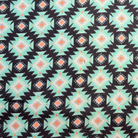 Cherry Pit Crafts microwaveable heating pad fabric with a teal, black, white, and orange geometric Southwestern pattern.