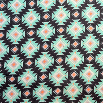 Cherry Pit Crafts microwaveable heating pad fabric with a teal, black, white, and orange geometric Southwestern pattern.