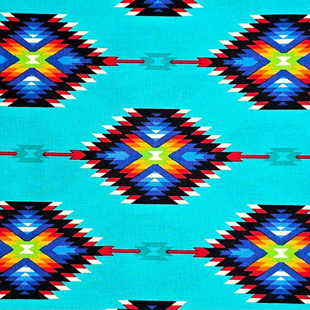 Cherry Pit Crafts turquoise heating pad with Southwestern geometric pattern in blue, red, yellow, and black. 100% cotton.