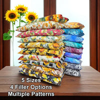 Cherry Pit Crafts microwaveable heating pads in sunflower patterns and multiple sizes. Cotton outer shell with cherry pit, rice, walnut, or flax seed filling.