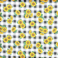 Cherry Pit Crafts microwaveable heating pad with sunflower pattern on black and white gingham fabric. Cotton shell.