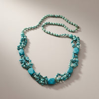 Handmade Cherry Pit Crafts turquoise beaded necklace with square and chip beads. Features multiple strands.