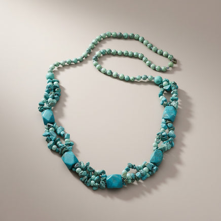 Handmade Cherry Pit Crafts turquoise beaded necklace with square and chip beads. Features multiple strands.
