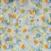 Cherry Pit Crafts microwaveable heating pad with cute cartoon turtles on a blue tie-dye background. 100% cotton.
