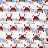 Cherry Pit Crafts red vintage car with American flags pattern on a cream background. 100% cotton.