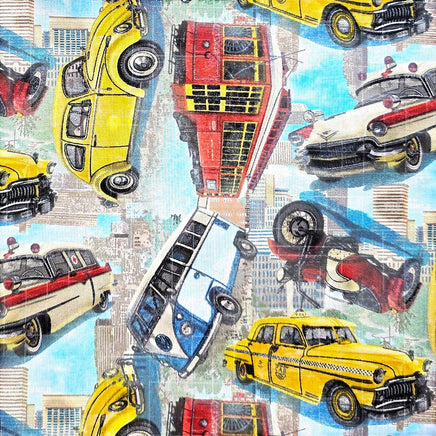 Cherry Pit Crafts vintage cars, trains, and planes fabric pattern with yellow VW Beetle, red double-decker bus, and yellow taxi.