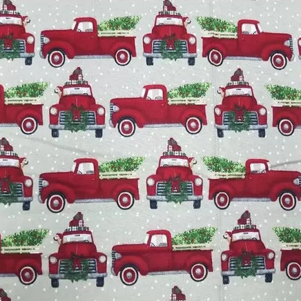 Cherry Pit Crafts vintage red trucks with Christmas trees and wreaths on a light grey background with white dots.