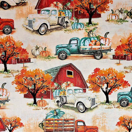Cherry Pit Crafts vintage trucks carrying pumpkins and fall foliage. 100% cotton fabric.