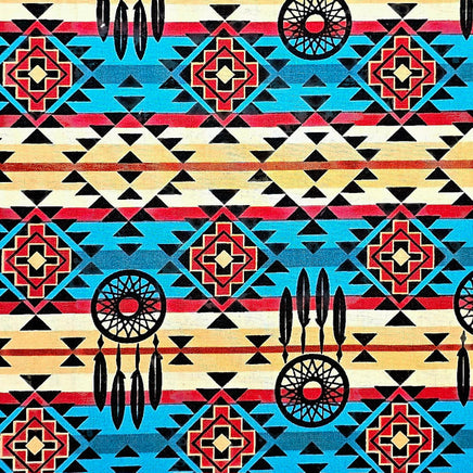 Cherry Pit Crafts microwaveable heating pad with Western bandana pattern, featuring dreamcatchers and feathers in red, blue, yellow, and black.