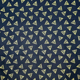 Navy blue fabric with small yellow triangle patterns