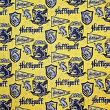 Hufflepuff-themed fabric with logos and text on a yellow background