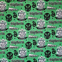 Pattern of Slytherin logos and text on a green background
