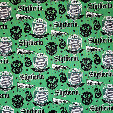 Pattern of Slytherin logos and text on a green background